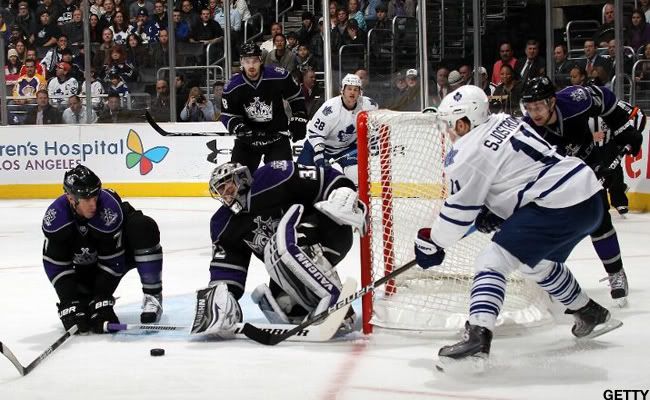 Rob Scuderi #7 and goaltender Jonathan Quick #32 of the Los Angeles Kings combine to stop Fredrik Sjostrom #11 of the Toronto Maple Leafs at the Staples Center on January 10, 2011 in Los Angeles, California. (Photo by Bruce Bennett/Getty Images)