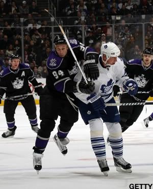 Ryan Smyth #94 of the Los Angeles Kings attempts to get past Tomas Kaberle #15 of the Toronto Maple Leafs at the Staples Center on January 10, 2011 in Los Angeles, California. (Photo by Bruce Bennett/Getty Images)