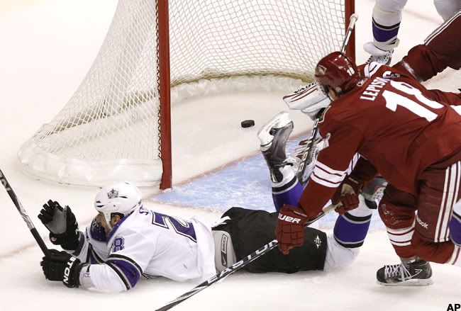 Los Angeles Kings' Jarret Stoll, left, celebrates his goal against the Phoenix Coyotes as Coyotes' as Coyotes' Sami Lepisto, of Finland, arrives late to defend during the third period of an NHL hockey game Saturday, Jan. 22, 2011, in Glendale, Ariz. The Kings defeated the Coyotes 4-3. (AP Photo/Ross D. Franklin)