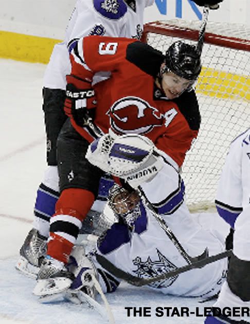 Zach Parise battles with Jonathon Quick at the net in Sunday's game between the Devils and Kings. William Perlman/Star-Ledger