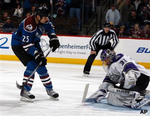 Colorado Avalanche right winger Chris Stewart, left, scores a goal against Los Angeles Kings goalie Erik Ersberg, of Sweden, in the shootout period of the Avalanche's 4-3 shootout victory in an NHL hockey game in Denver on Wednesday, March 24, 2010. (AP Photo/David Zalubowski)