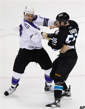 San Jose Sharks left wing Ben Eager (55) and Los Angeles Kings left wing Kyle Clifford, left, get into a fight in the first period of Game 1 of an NHL hockey first-round Western Conference playoff series in San Jose, Calif., Thursday, April 14, 2011. (AP Photo/Paul Sakuma)