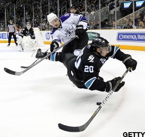 Drew Doughty #8 of the Los Angeles Kings gets a penalty call for tripping Kyle Wellwood #20 of the San Jose Sharks in Game One of the Western Conference Quarterfinals during the 2011 NHL Stanley Cup Playoffs at the HP Pavilion on April 14, 2011 in San Jose, California. (Photo by Thearon W. Henderson/Getty Images)