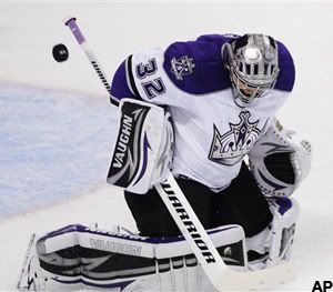 Los Angeles Kings goalie Jonathan Quick deflects a San Jose Sharks shot in the first period of Game 1 of an NHL hockey first-round Western Conference playoff series in San Jose, Calif., Thursday, April 14, 2011. (AP Photo/Paul Sakuma)