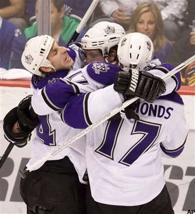 Los Angeles Kings' Wayne Simmonds, right to left, celebrates his second period goal against the Vancouver Canucks with teammates Anze Kopitar and Justin Williams in the first round of a NHL western conference playoff hockey game at GM Place in Vancouver, Canada, on Saturday, April 17, 2010. (AP Photo/The Canadian Press, Jonathan Hayward)
