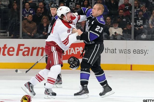 Shane Doan #19 of the Phoenix Coyotes fights against Dustin Brown #23 of the Los Angeles Kings at Staples Center on February 16, 2012 in Los Angeles, California. (Photo by Andrew D. Bernstein/NHLI via Getty Images)