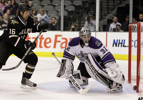 Dallas Stars right wing Adam Burish (16) pressures as Los Angeles Kings goalie Jonathan Quick (32) looks on as the puck deflects off the goal post in the third period of an NHL hockey game, Thursday, Oct. 28, 2010, in Dallas. The Kings won 5-2. (AP Photo/Tony Gutierrez)