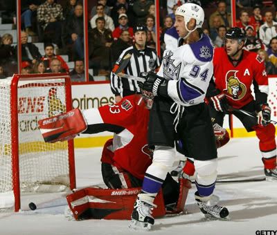 Ryan Smyth #94 of the Los Angeles Kings deflects a point shot into the net behind Pascal Leclaire #33 of the Ottawa Senators for a goal only to have it waived off for a high-stick violation during a game at Scotiabank Place on November 22, 2010 in Ottawa, Ontario, Canada. (Photo by Phillip MacCallum/Getty Images)